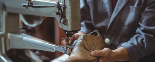 shoemaker-using-sewing-machine-in-workshop-2025-10-28-21-52-10-utc